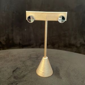 Brand new studs; .25 inch diameter; silver and black